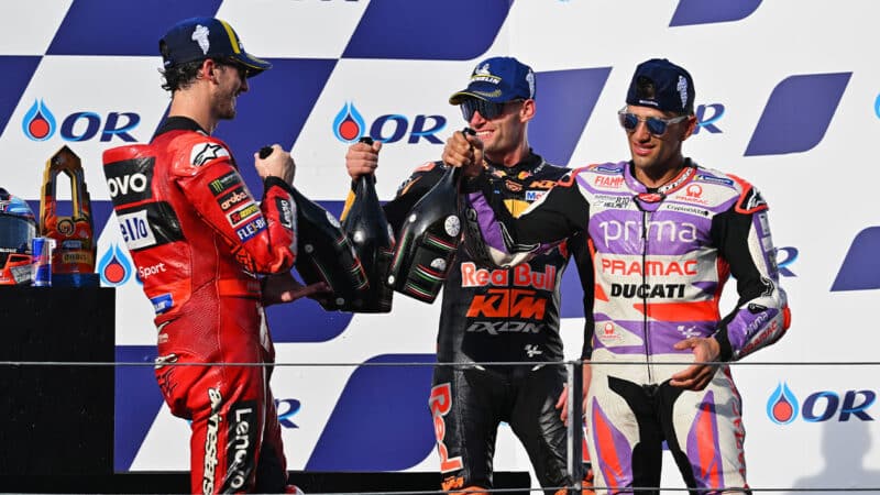 Jorge Martin with Pecco Bagnaia and Brad Binder on 2023 MotoGP Thai GP podium