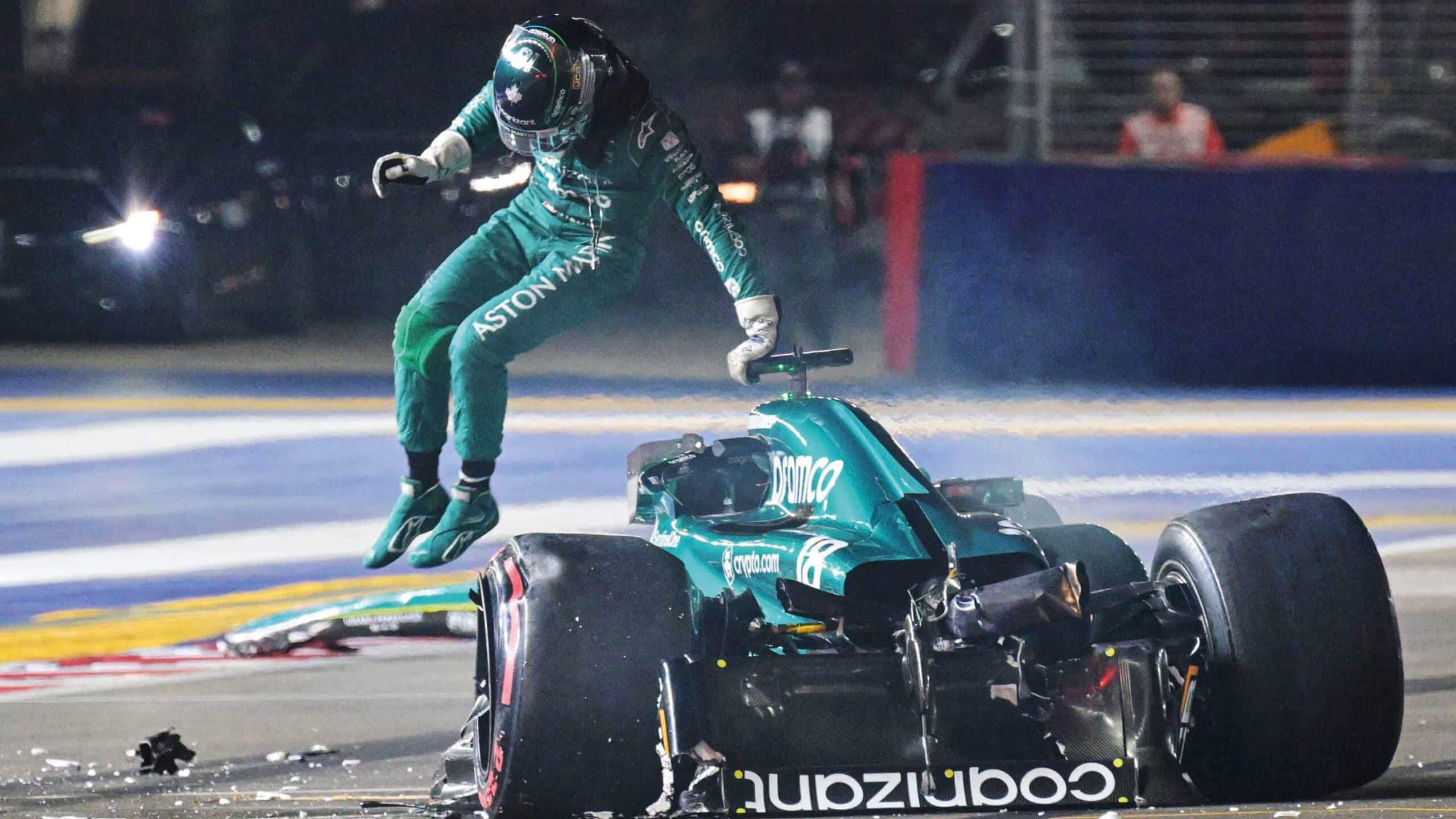 Lance Stroll jumping out of Aston Martin