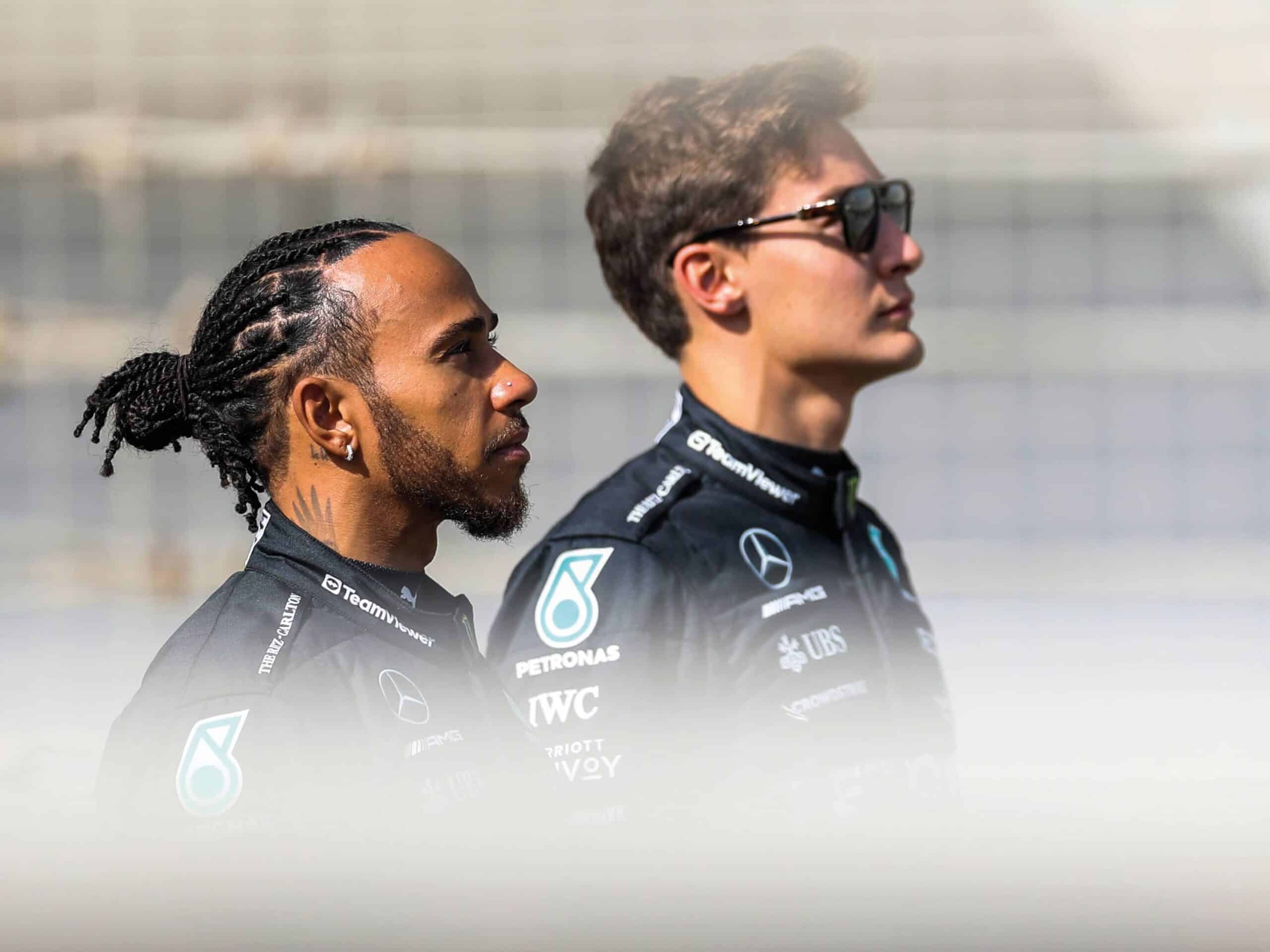 Lewis Hamilton and George Russell, stand side by side