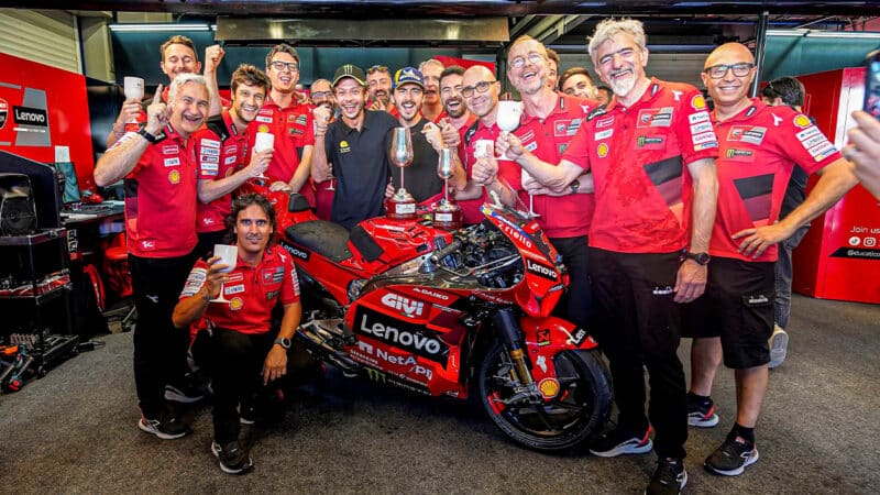 Pecco Bagnaia celebrates 2023 MotoGP win at Mugello with Ducati team and Valentino Rossi