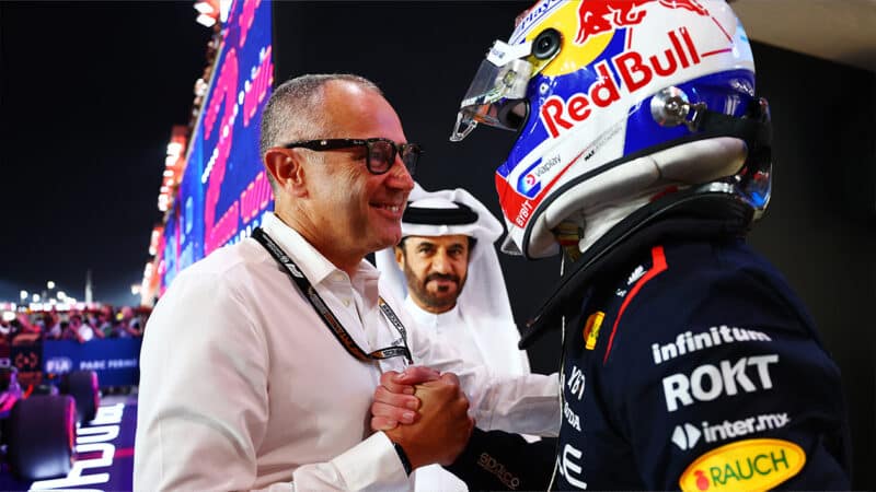 Stefano Domenicali shakes the hand of Max verstappen after 2023 Qatar GP sprint race