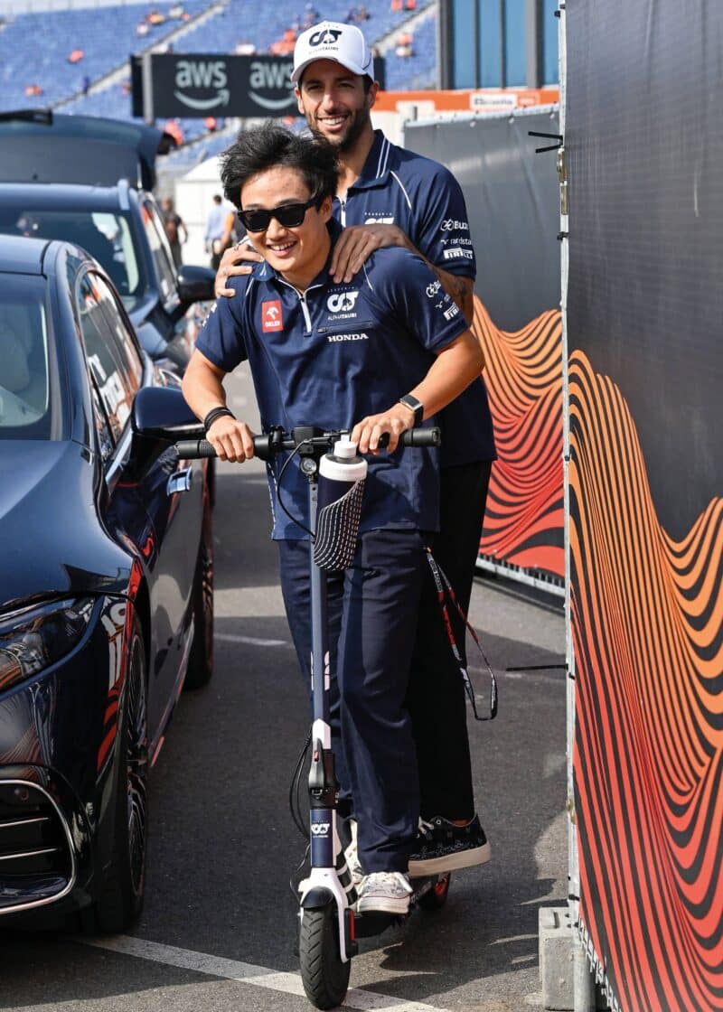 Yuki Tsunoda and Daniel Ricciardo share a scotter