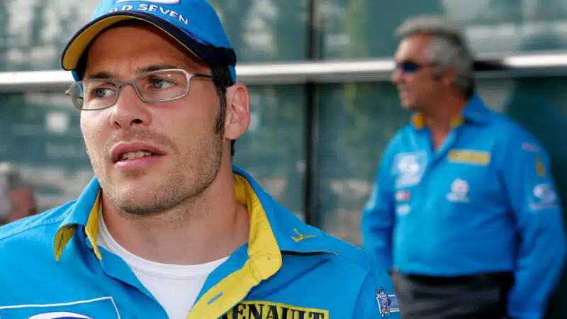 Jacques Villeneuve in Renault team outfit with Flavio Briatore in background