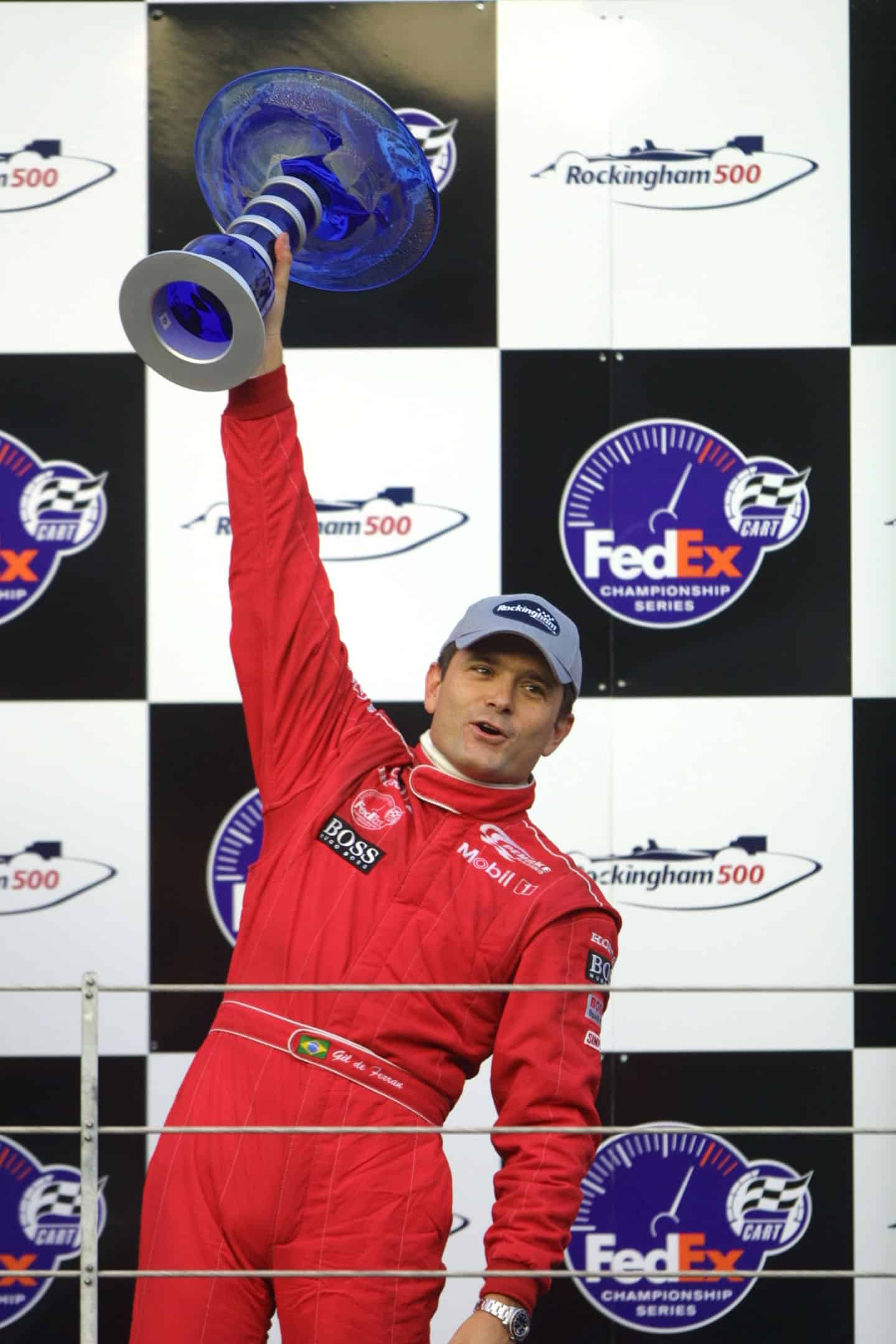 Gil-de-Ferran-celebrates-winning-2001-Rockingham-IndyCar-race-on-the-podium