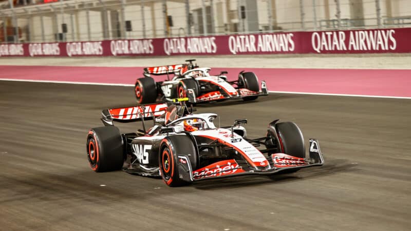 Haas F1 cars driving in formation at Qatar Grand Prix weekend