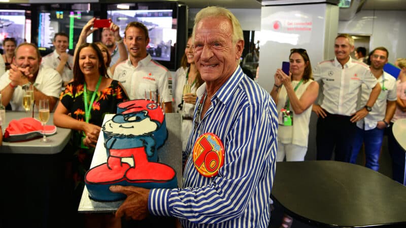 John Button celebrates his 70th birthday with Smurf cake in McLaren pit garage