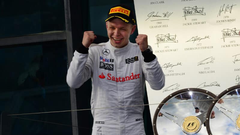 Kevin Magnussen celebrates after finishing on the podium in 2014 Australian Grand Prix