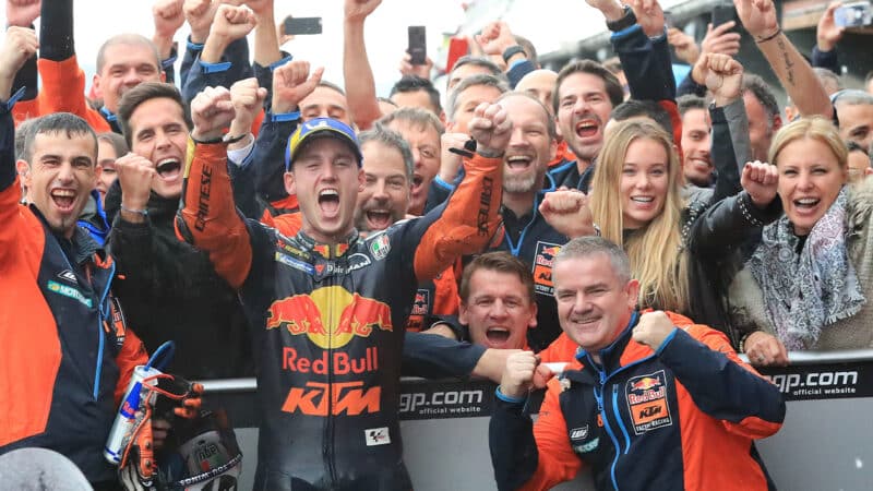 Pol Espargaro cheering with KTM MotoGP crew after 2018 Valencia podium
