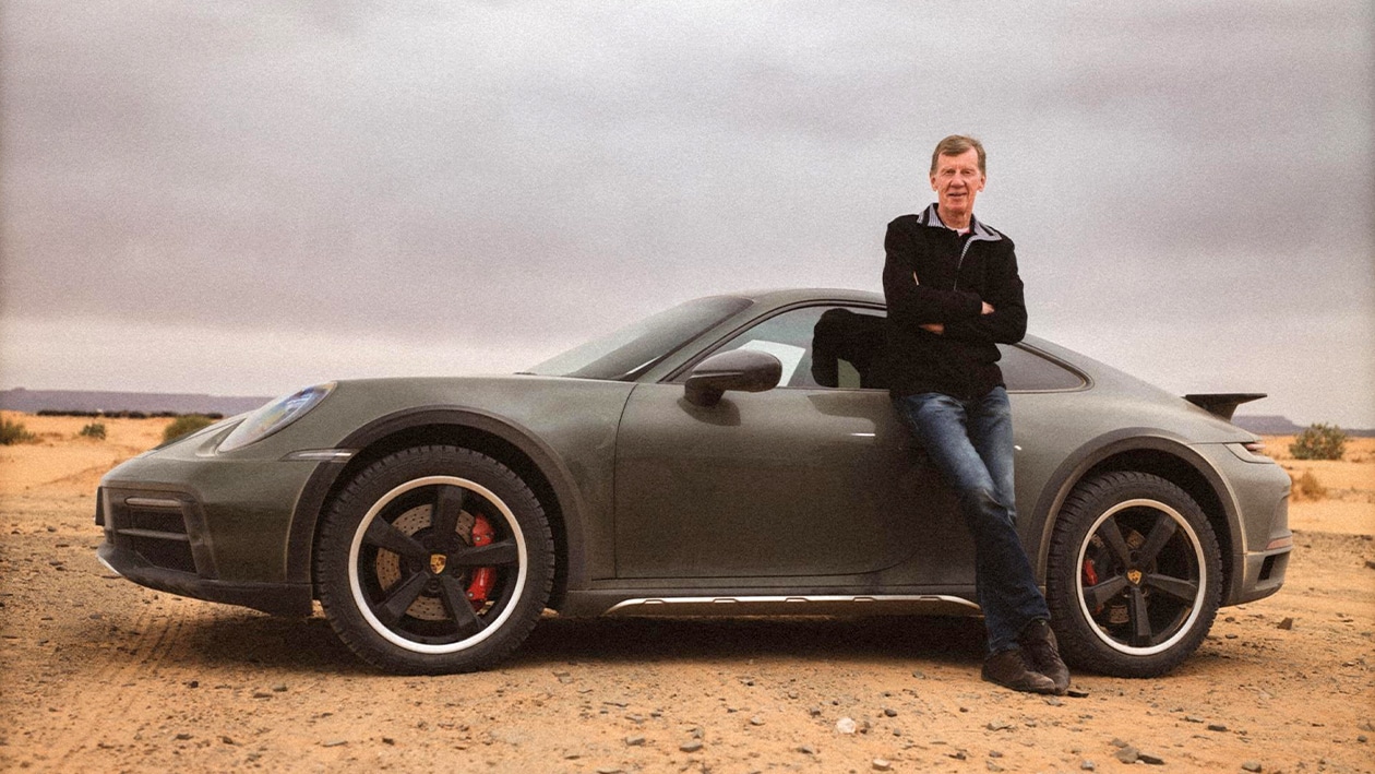 Walter Rohrl with dark coloured Porsche 911 Dakar