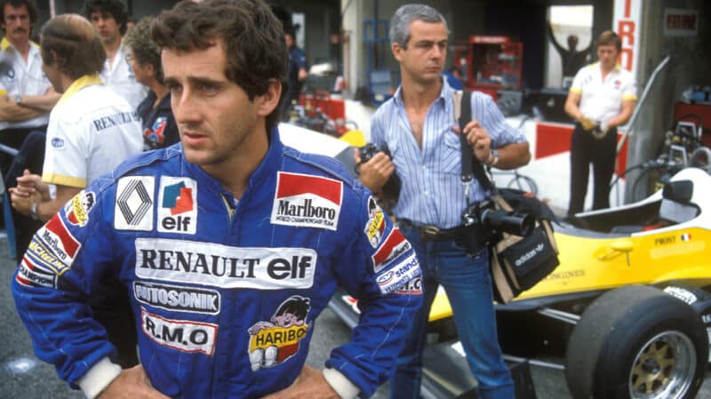 Alain Prost with Renault car in F1 pits 1983