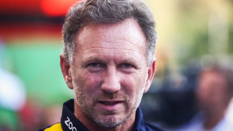 Christian Horner looks straight at the camera in 2022 f1 pitlane