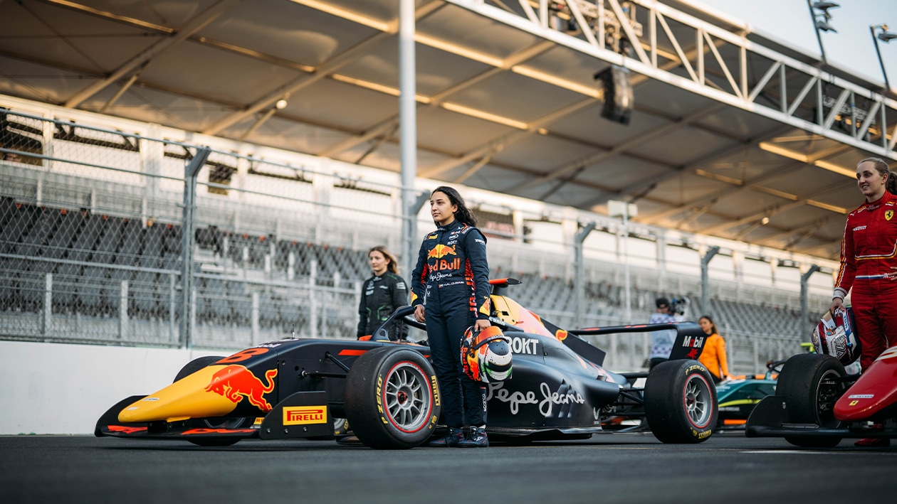 Hamda Al Qubaisi next to F1 Academy Red Bull sponsored car