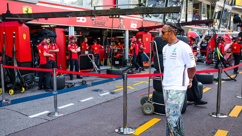 Lewis Hamilton looks in at the Ferrari garage at the Monaco Grand Prix