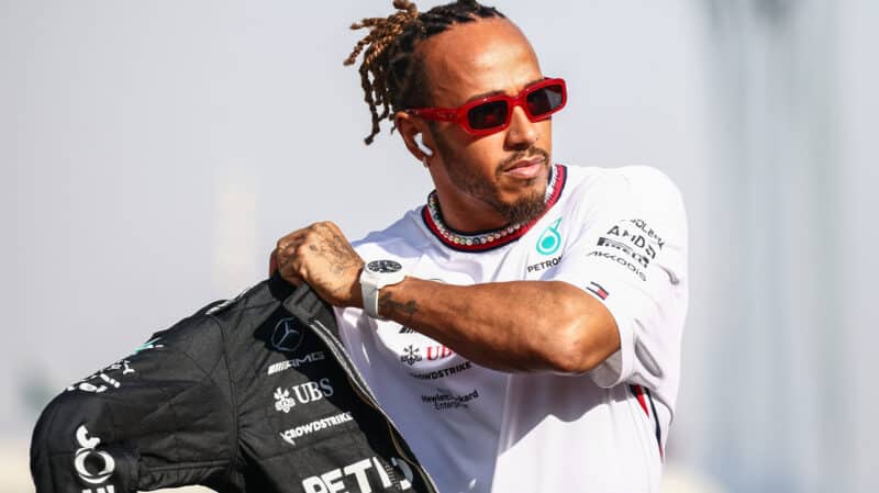 Lewis Hamilton puts on Mercedes F1 racesuit