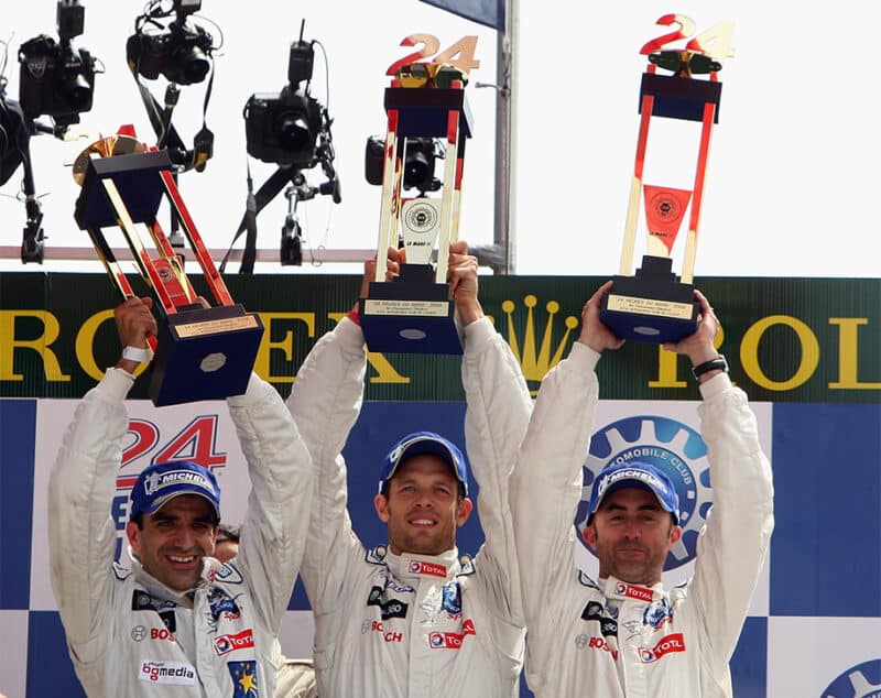 Marc Gene with Alex Wurz and David Brabham on the podium after winning 2009 Le Mans 24 Hours