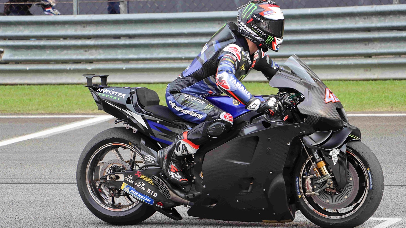 Side view of Alex Rins on black Yamaha in preseason 2024 MotoGP testing