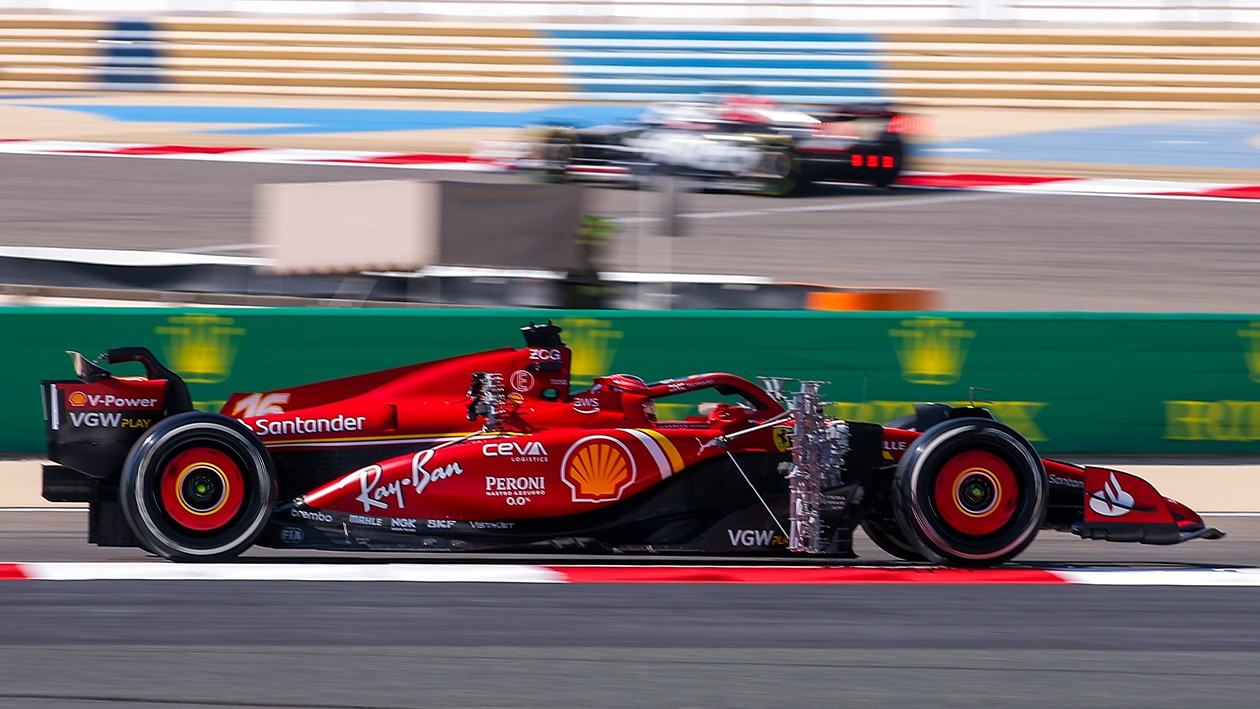 Side view of Ferrari in 2024 F1 testing with aero rakes