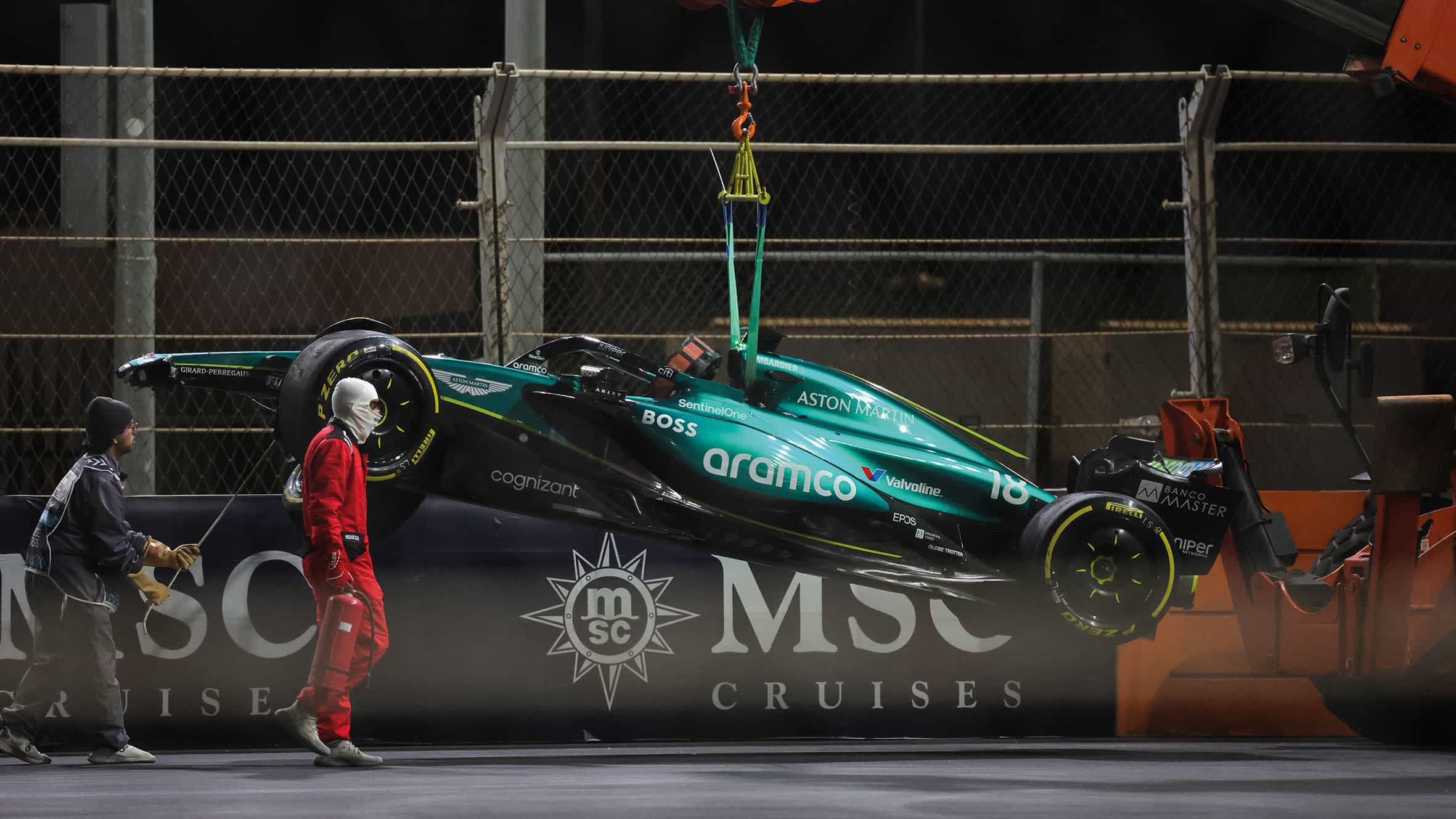 Aston Martin’s Lance Stroll, lifted by crane
