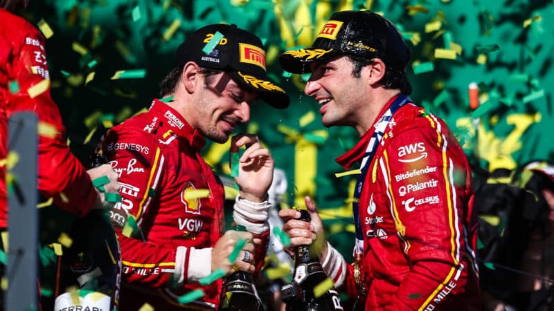 Charles Leclerc and Carlso Sainz on the 2024 F1 Australian Grand Prix podium with champagne surrounded by ticker tape