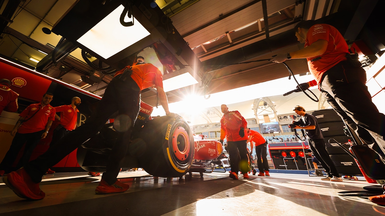 Ferrari F1 car in pits during 2024 Bahrain preseason testing