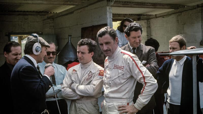 Oliver gets a grilling with Chapman and Lotus team-mate Graham Hill at Brands Hatch