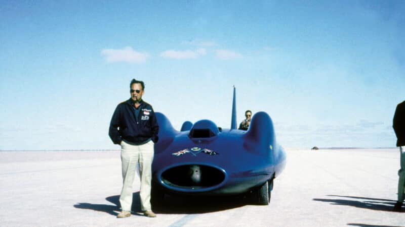 Campbell poses with Bluebird on the Lake Eyre salt. It was a mighty effort to even get there. Previous spread, right: Campbell holds the team’s mascot Mr Whoppit, a stuffed bear