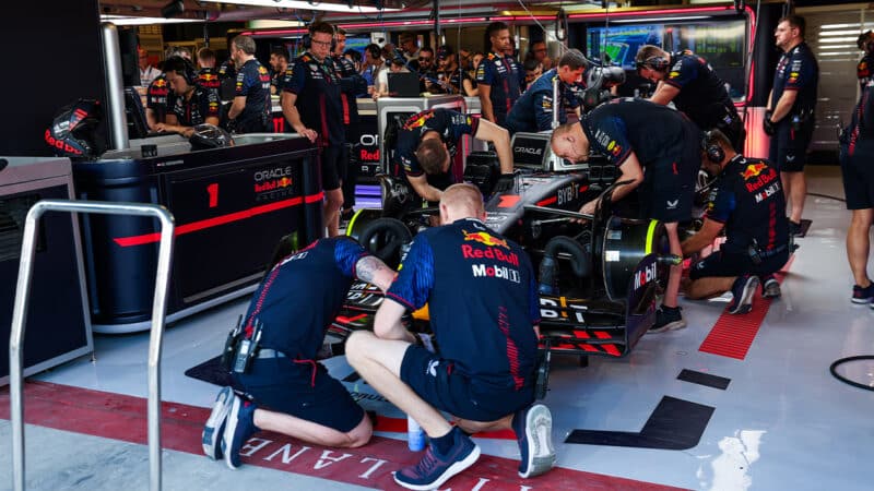 Mechanics work on Red Bull of Max Verstappen at 2023 Abu Dhabi Grand Prix