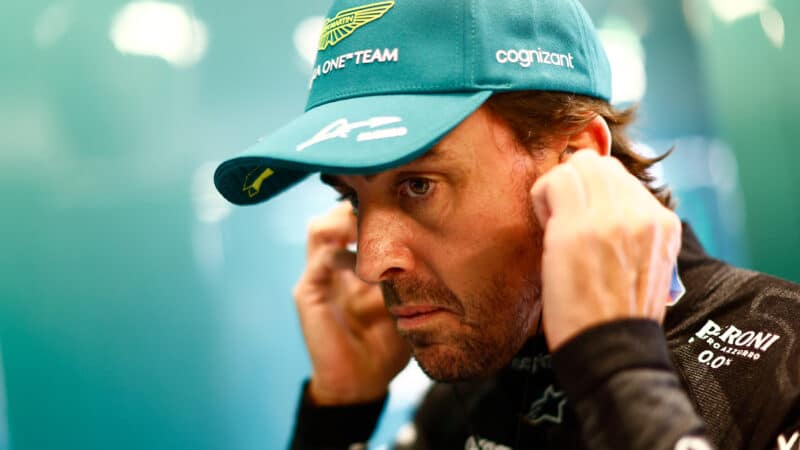 Fernando Alonso portrait in F1 pit garage