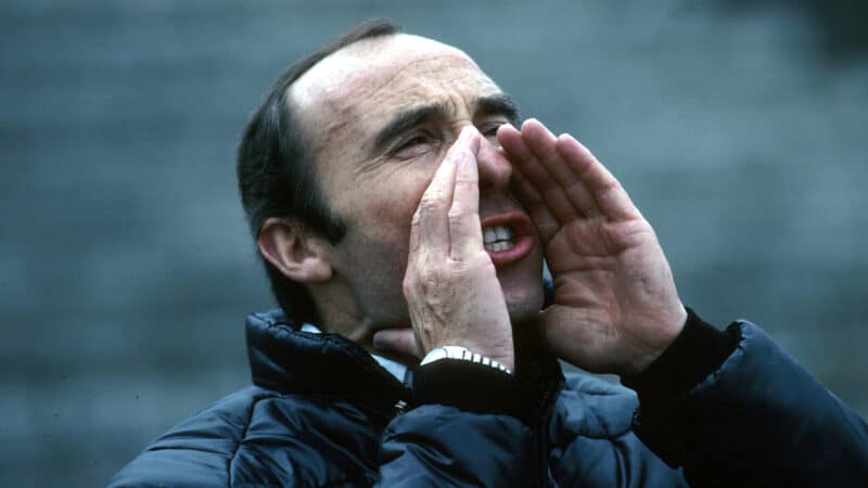 Frank Williams cupping his hands to his mouth and shouting in 1980 picture