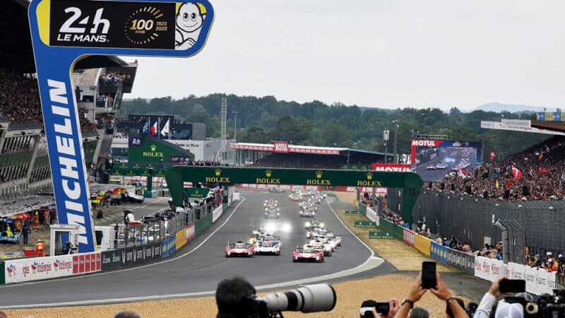 The making of history: the twin Ferrari 499Ps lead the field away for the start of Le Mans’ centenary race