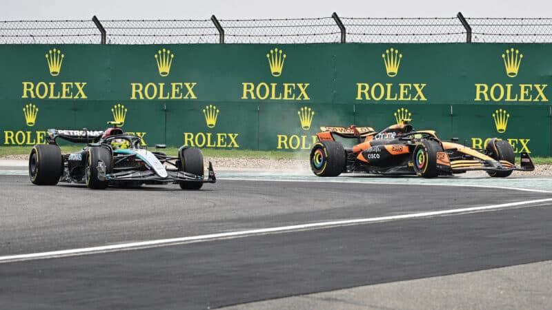 Lewis Hamilton and Lando Norris square up in the early stages of the Shanghai sprint race