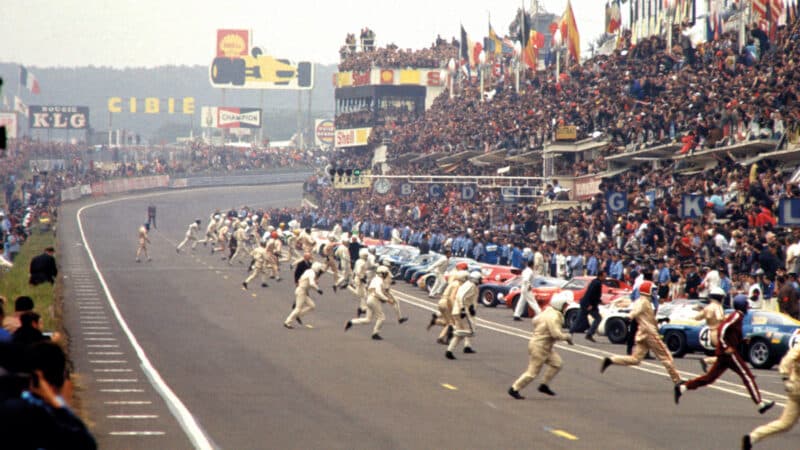 In no hurry: Ickx saunters across the track to his car in an image that wouldn’t be out of place in Hollywood. The traditional running start was dropped a year later