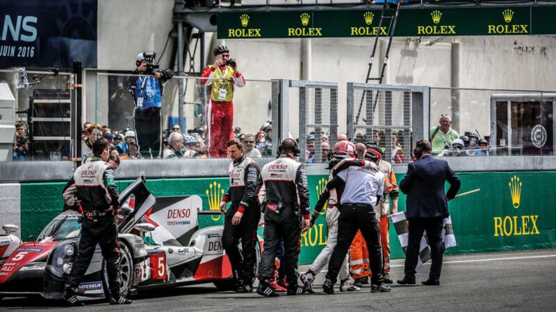 A distraught Kazuki Nakajima is helped away from his stricken Toyota at the end of the 2016 Le Mans. His final lap was beyond the maximum six minutes, so the car couldn’t be classified