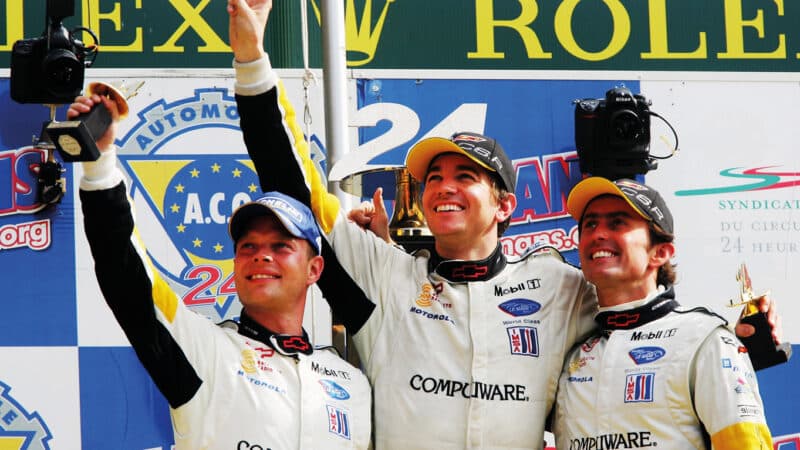 Oliver Gavin, centre, on the podium at Le Mans in 2006 with Jan Magnussen, left, and Olivier Beretta