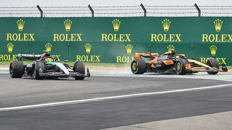 Lando Norris runs off the track next to Lewis Hamilton at the start of the 2024 F1 Chinese GP