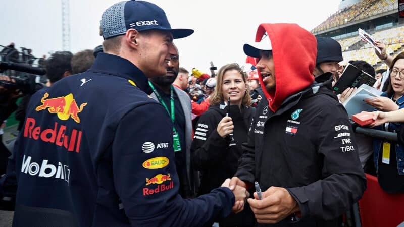 Lewis Hamilton shakes hands with Max Verstappen ahead of the 2018 F1 Chinese Grand Prix