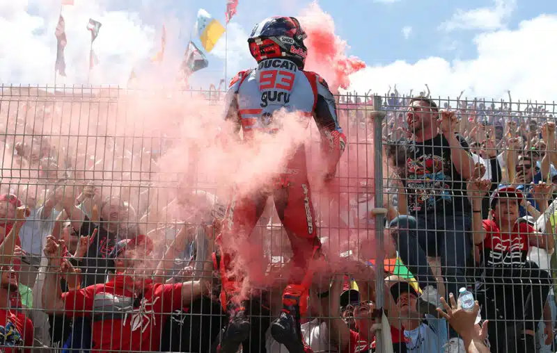 Marc Marquez climbs the fence between him and fans at 2024 MotoGP Spanish GP