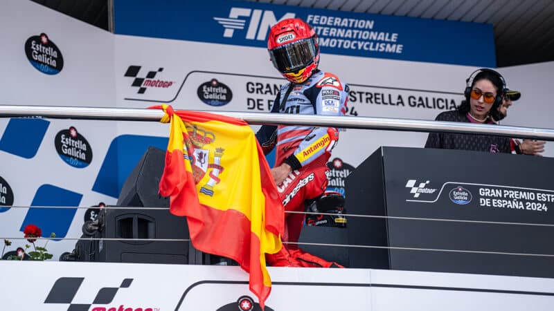 Marc Marquez dances in front of fans on the podium at 2024 MotoGP Spanish GP