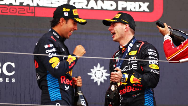 Max Verstappen and Sergio Perez celebrate 1-2 finish on the podium at 2024 F1 Japanese Grand Prix