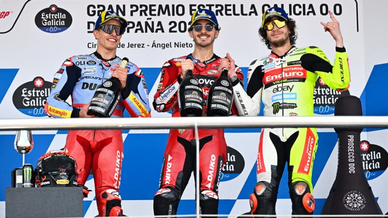 Pecco Bagania on MotoGP podium with Marc Marquez and Marco Bezzecchi at 2024 Spanish GP