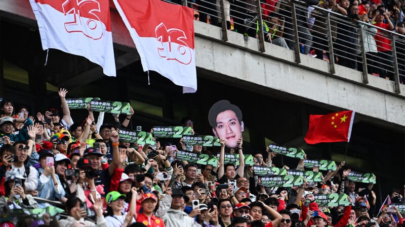 Zhou Guanyu fans in stands hold up banners at 2024 F1 Chinese GP