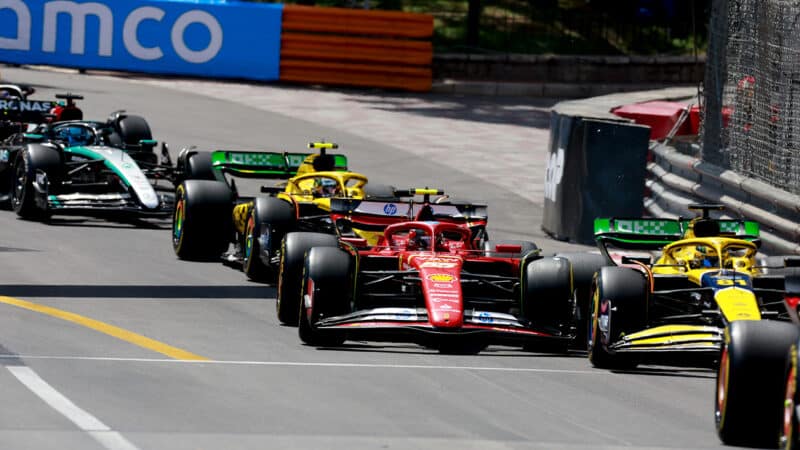 Carlos Sainz alongside Oscar Piastri at the start of 2024 F1 Monaco Grand Prix