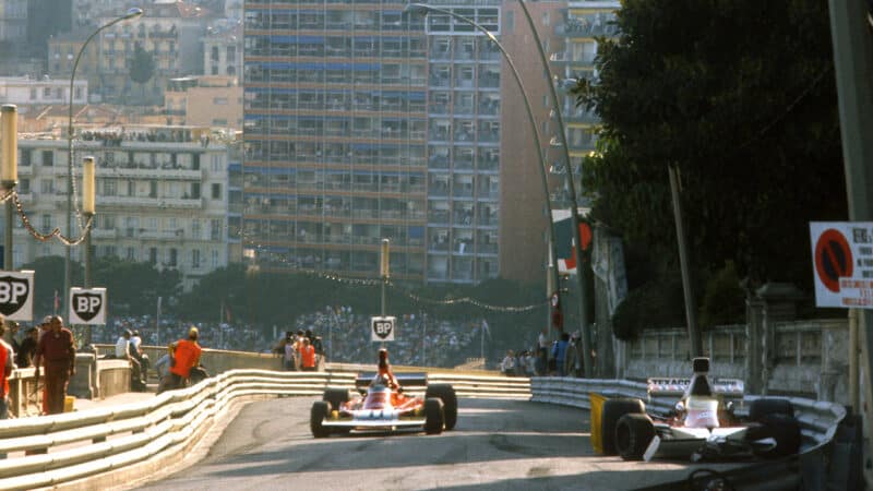 Clay Regazzoni pases wrecked McLaren of Denny Hulme in 1974 Monaco Grand Prix
