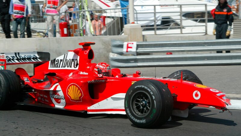 Schumacher picked up damage to the front of his F2004 in the unusual shunt