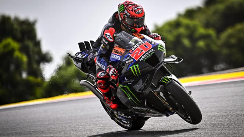 Fabio Quartararo leans forward on MotoGP Yamaha M1 to control wheelie