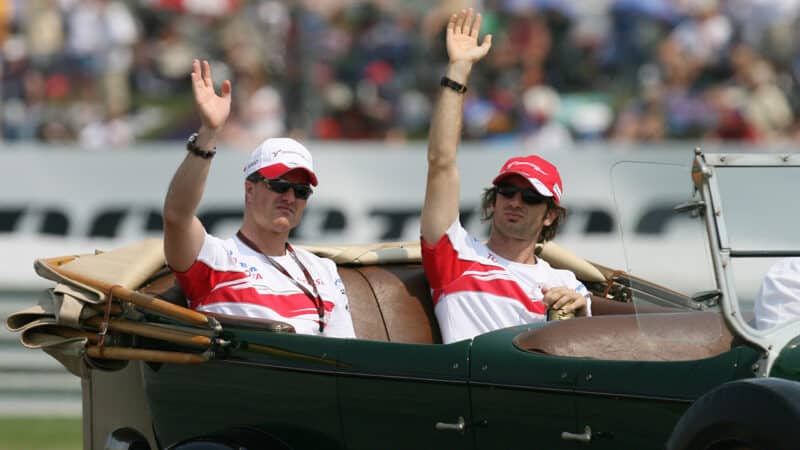 Grumpy looking Ralf Schumacher next to JArno Trulli in drivers parade ahead of 2007 United States Grand Prix