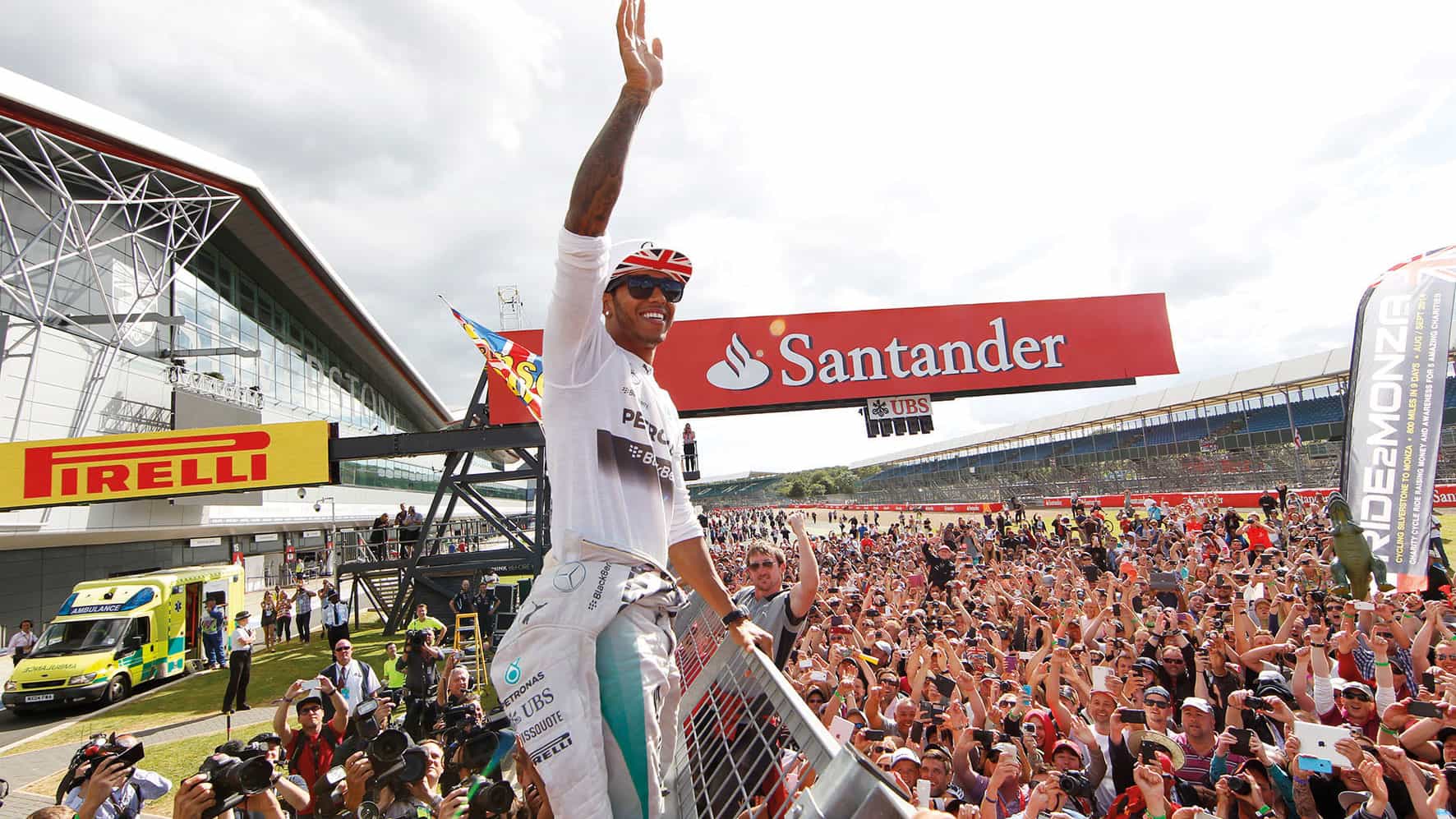 Lewis Hamilton waves to the fans