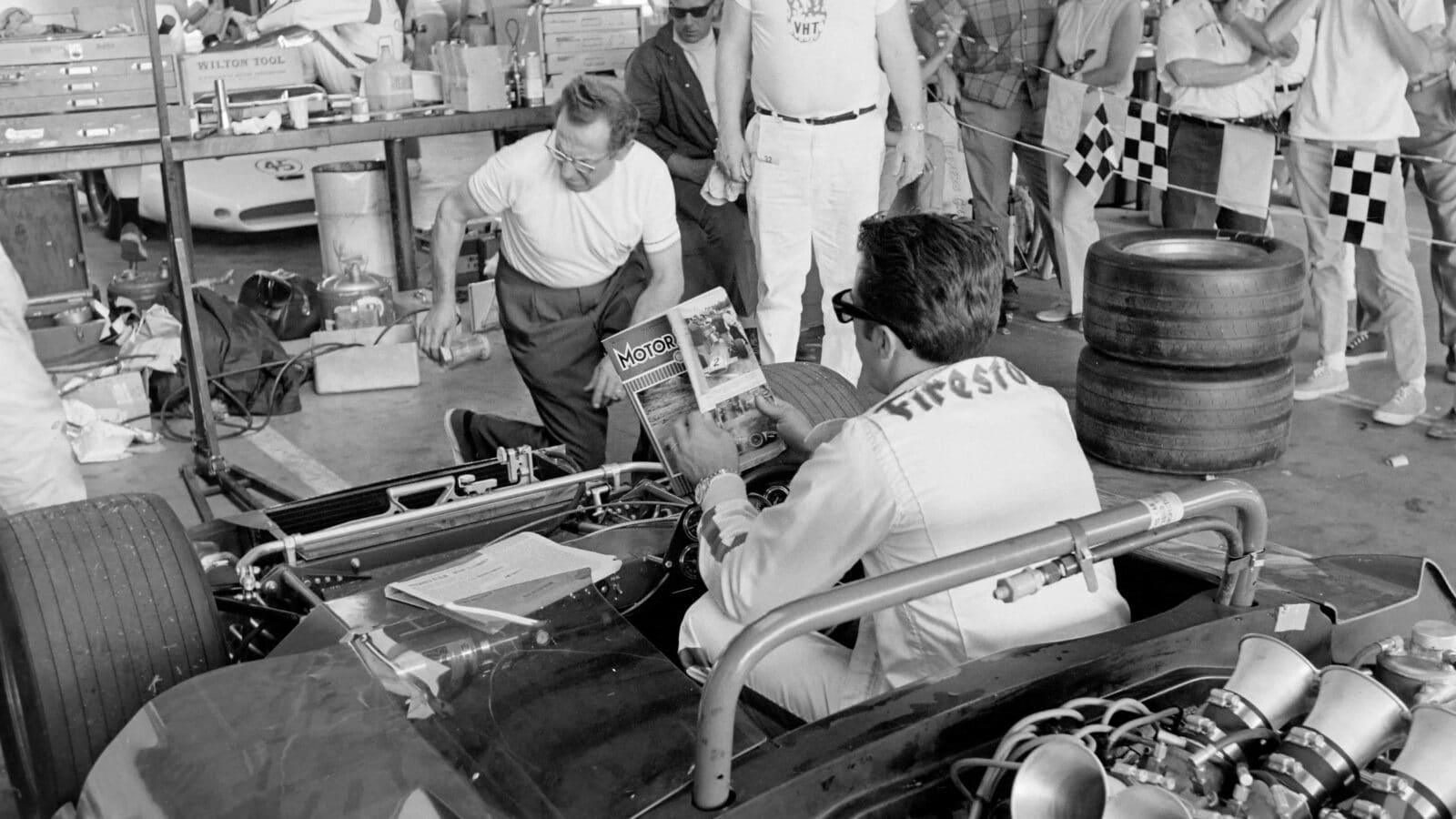 Mario Andretti reading Motor Sport Magazine November 1968