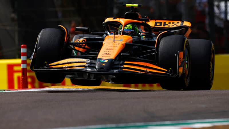 McLaren of Lando Norris ju,ps over kerb at Imola during 2024 F1 Emilia Romagna Grand Prix