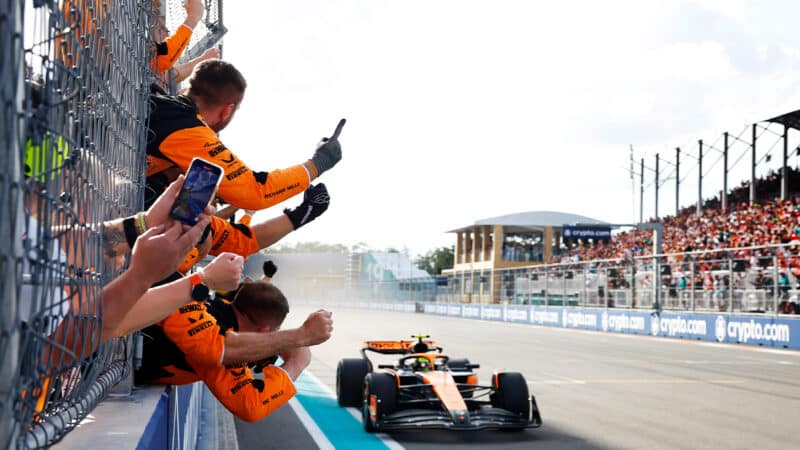 McLaren team cheers from the pitwall as Lando Norris crosses the line to win the 2024 F1 Miami GP